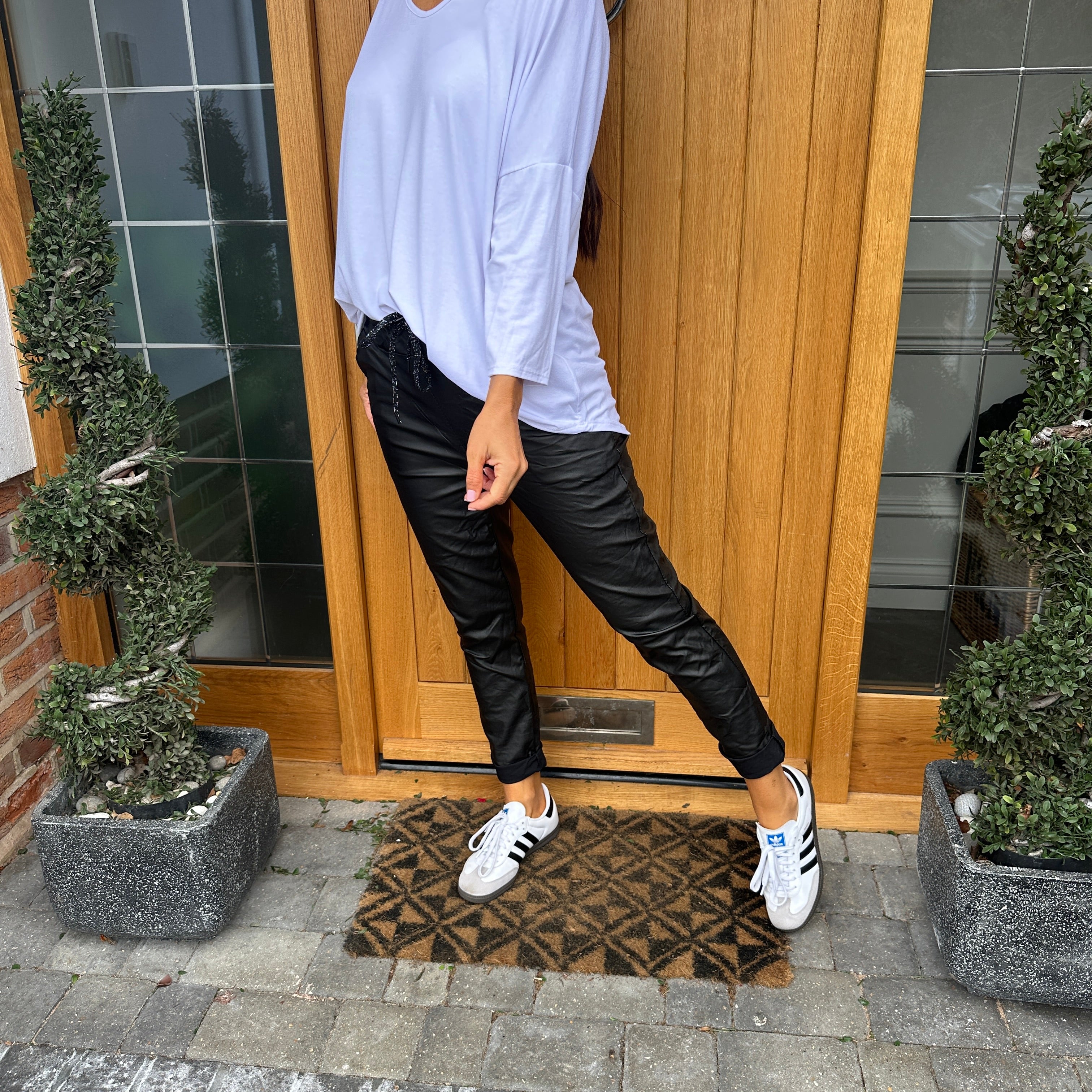 Leather pants hot sale white sneakers